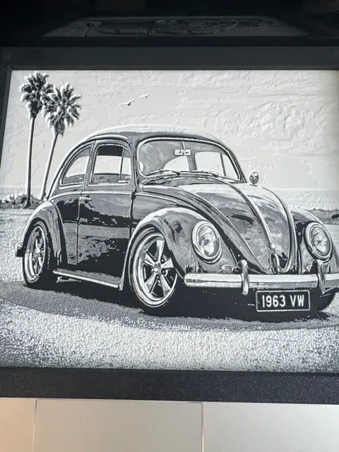 Framed grayscale HueForge of a classic Volkswagen Beetle with palm trees