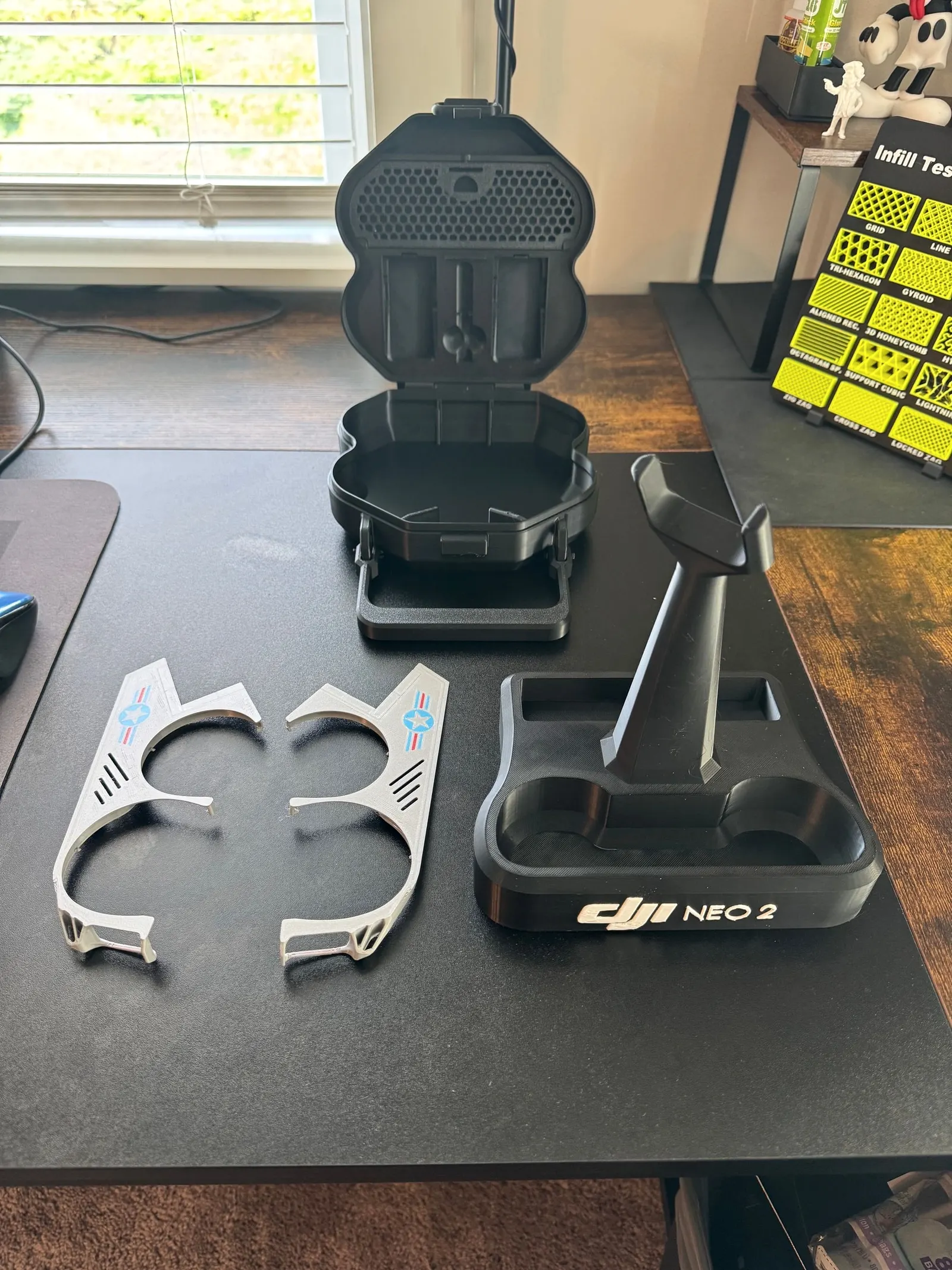 Printed carrying case, charging stand and decorated propeller guards for a small drone